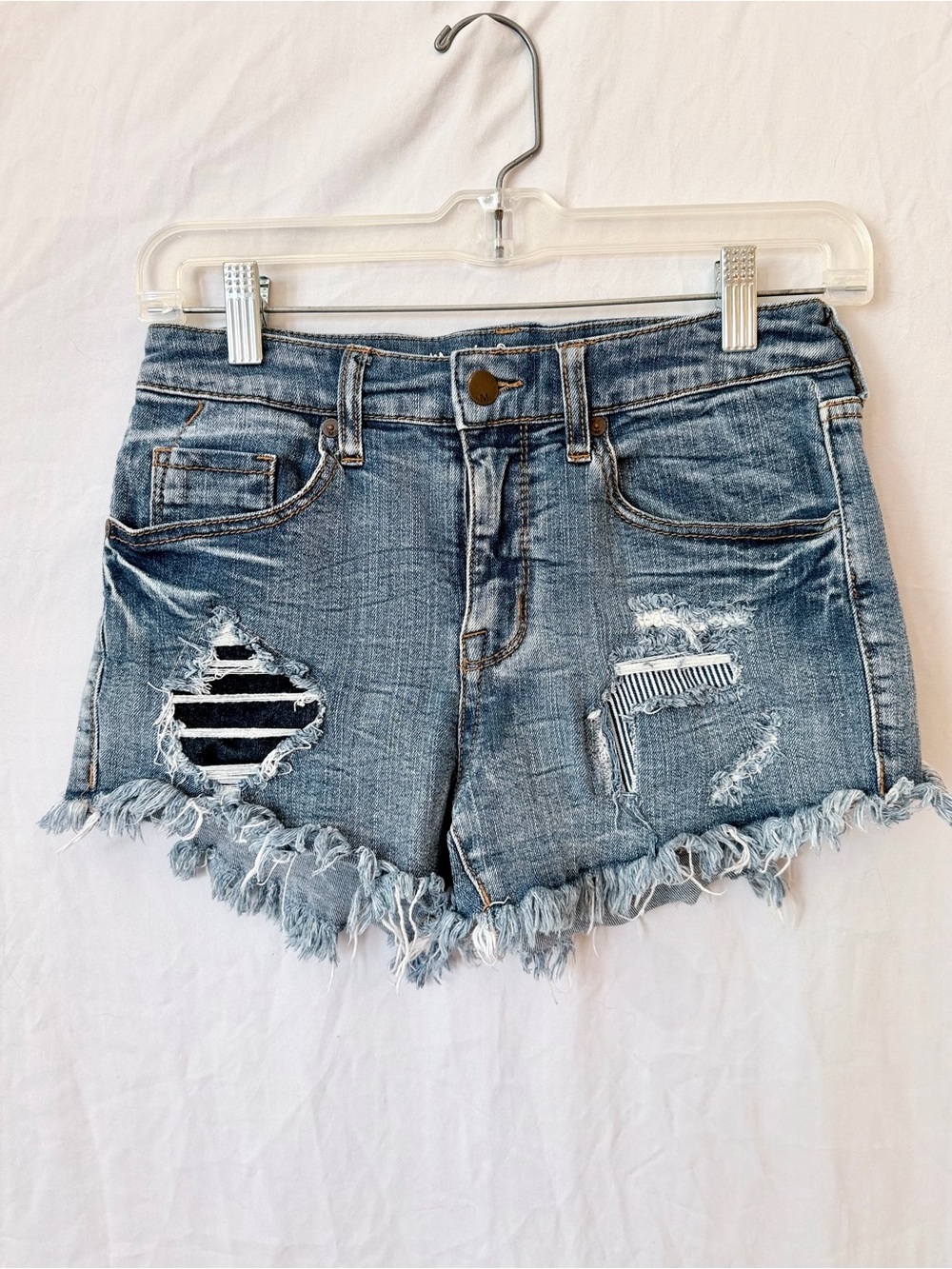 High Rise Distressed Denim Shorts Raw Hem Patch Detail